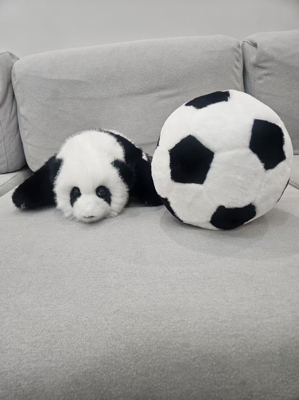 Panda and football plush set detail close up