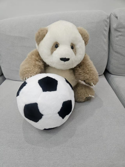 Brown panda and football plush set detail close up